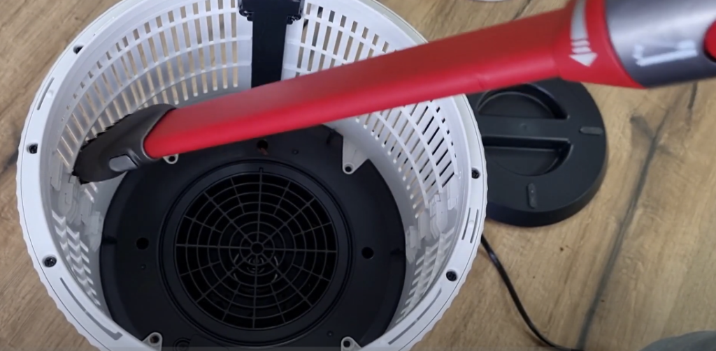 Using a Vacuum Cleaner with Brush Attachment to Clean a Shark Air Purifier